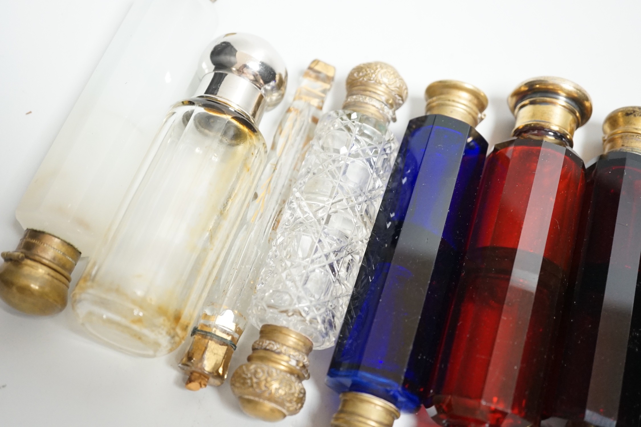 Seven 19th century coloured glass double ended scent bottles and three others